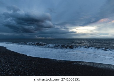 Dramatic Storm Over Madeira Ocean Shoreline With Dark Clouds, Rolling Waves And Moody Blue Lighting. 