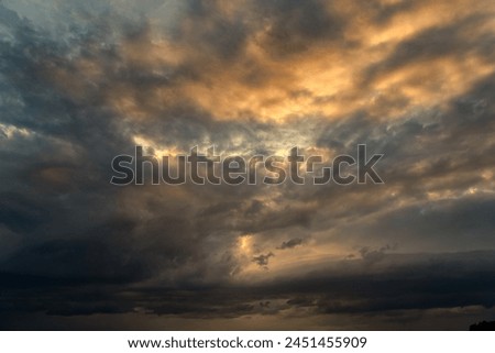 Dramatic storm sunset clouds skies heaven cloudscape background. Natural backgrounds: stormy sky.