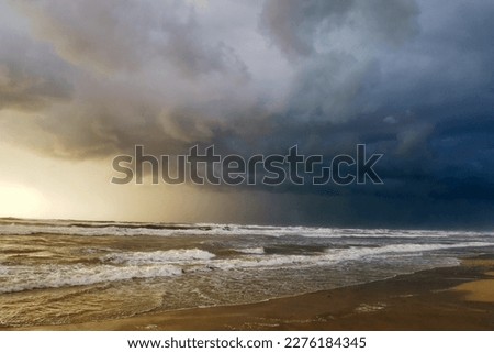 Dramatic stormy dark cloudy sky over at Herzliya Beach. Natural background photo. Sunset at sea. Winter Storm. Seascape.