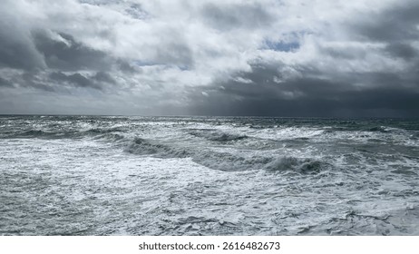 Dramatic stormy ocean waves beneath overcast sky, evoking concepts of natures power and coastal adventure, perfect for World Oceans Day