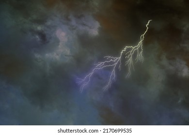 dramatic stormy sky with dark clouds, lightning flashes over the night sky. Concept on the theme of Severe Weather, natural disasters, hurricane, typhoon, tornado, storm, natural basis for designer