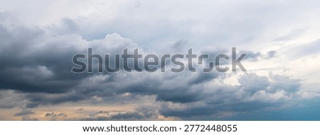 Dramatic stormy sky with dark heavy clouds before rain