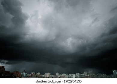 Dramatic stormy sky over modern city residential district. Low angle shot. - Powered by Shutterstock