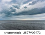 Dramatic stormy sky over the sea. Bad weather at the resort.