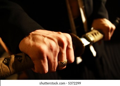 Dramatic Studio Shot Of Man Holding Samurai Sword