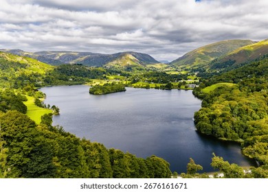 Dramatic summer clouds and sunshine over the Grasmere valley, Lake District National Park