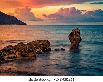 Dramatic summer scene of Palinuro with dramatic clouds. Majestic morning view of cliffs near Natural Arch of Palinuro, Italy, Europe. Fabulous sunrise on Mediterranean sea.