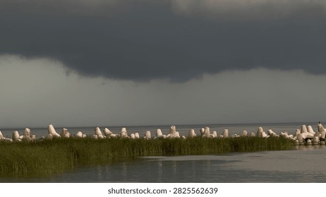 Dramatic Summer Storm Clouds Gathering Above a Dark River Before a Hurricane