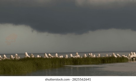 Dramatic Summer Storm Clouds Gathering Above a Dark River Before a Hurricane