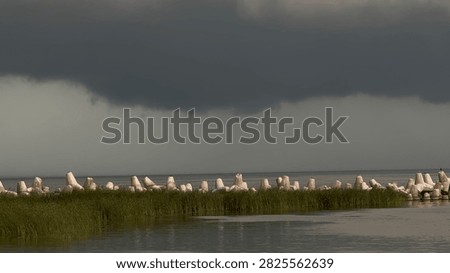 Dramatic Summer Storm Clouds Gathering Above a Dark River Before a Hurricane