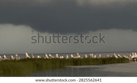 Dramatic Summer Storm Clouds Gathering Above a Dark River Before a Hurricane