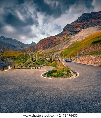 Dramatic summer view of famous Italian pass - Stelvio High Alpine Road, South Tyrol, province of Sondrio. Incredible evening scene of Ortler Alps, Italy, Europe. Traveling concept background.