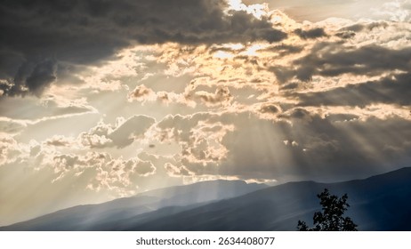 Free Stock Photo of Sun rays breaking through clouds over hills ...