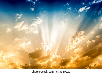 Dramatic Sun Rays And Clouds As Background 