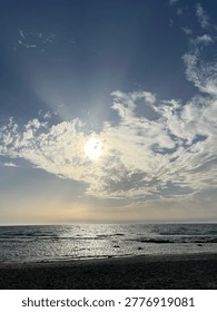 Dramatic Sunbeams Breaking Through Clouds Over the Mediterranean Sea