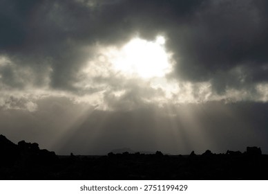 Dramatic Sunbeams Breaking Through Dark Storm Clouds - Powered by Shutterstock - Get 15% off with code: PIKWIZARD15