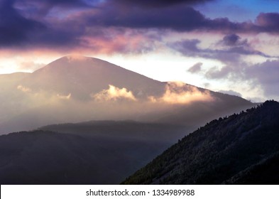 Dramatic Sunrise in the Mountains with Cloudy Sky and Misty Forest, Altai Mountains, East Kazakhstan. Fantasyland, Blue Hour Concept