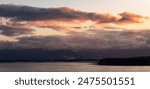 Dramatic Sunrise over Alaska Coast. Nature Background.