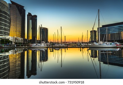dramatic sunrise sky Docklands reflections Melbourne city clear sky calm water