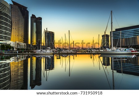 dramatic sunrise sky Docklands reflections Melbourne city clear sky calm water