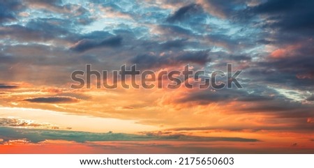 Dramatic sunrise sundown sky background with colorful clouds without birds. Panoramic sky background
