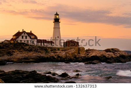 Dramatic sunset by Portland Head lighthouse in Maine. It is one of the most popular historical locations in New England, and it is the oldest beacon in Maine.
