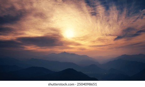 Dramatic sunset casting warm hues over distant mountain ranges, with swirling clouds and ethereal light creating a serene, majestic atmosphere.