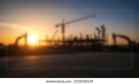 A dramatic sunset casts a warm glow over a construction site, with towering cranes and heavy machinery silhouetted against the sky.