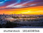 Dramatic sunset clouds over Jerusalem: panoramic view of the Old and New City skyline, of the Temple Mount with the Dome of the Rock, of the eastern wall with Golden Gate, and of Kidron Valley