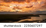 Dramatic Sunset Cloudscape over the marsh with curving river on Cape Cod, Massachusetts, USA, oceanside beach seascape in Provincetown at twilight