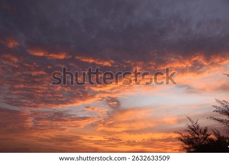 A dramatic sunset fills the evening sky with fiery orange and deep purple clouds, creating a breathtaking natural spectacle. Ideal for landscape art and travel photography. #DramaticSunset #EveningSky