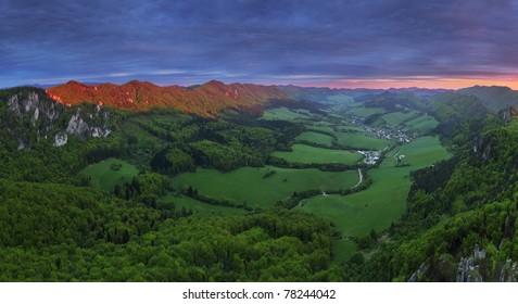 Dramatic sunset in green summer mountain.