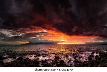 A dramatic sunset looking over the Pacific Ocean, Maui, Hawaii.