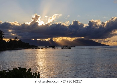 Dramatic sunset on the luxury overwater bungalow villas in Bora Bora - Powered by Shutterstock