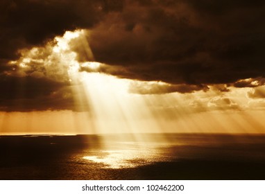 Dramatic Sunset On The Sea, Beautiful Peaceful Scene, Bright Sun Light, Rays Of Light Shine In Water, Sunbeam In Cloudy Sky, Summer Ocean View, Paradise Beach