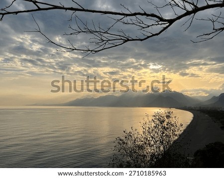 Dramatic Sunset Over Konyaaltı Beach and the Taurus Mountains, Antalya, Turkey