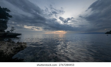 Dramatic Sunset Over Calm Ocean Waters