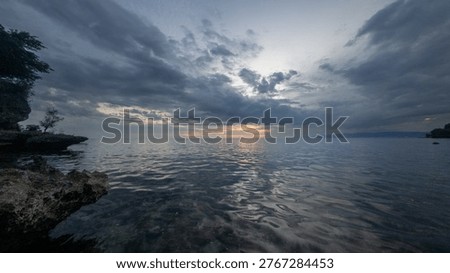 Dramatic Sunset Over Calm Ocean Waters