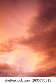 Dramatic sunset over a dark landscape with fiery clouds, atmosph