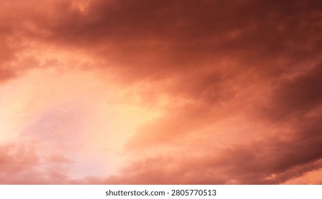 Dramatic sunset over a dark landscape with fiery clouds, atmosph
