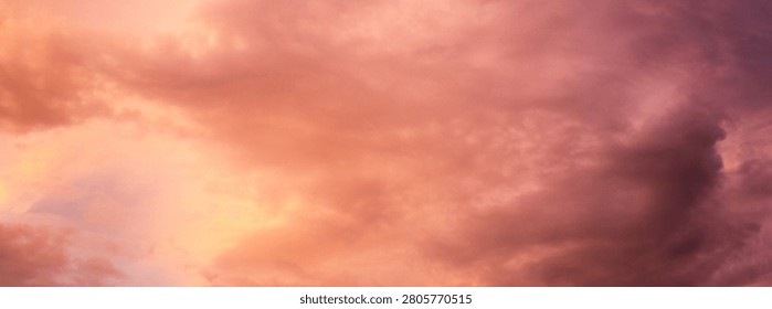 Dramatic sunset over a dark landscape with fiery clouds, atmosph