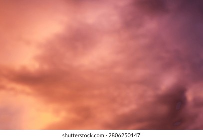 Dramatic sunset over a dark landscape with fiery clouds, atmosph