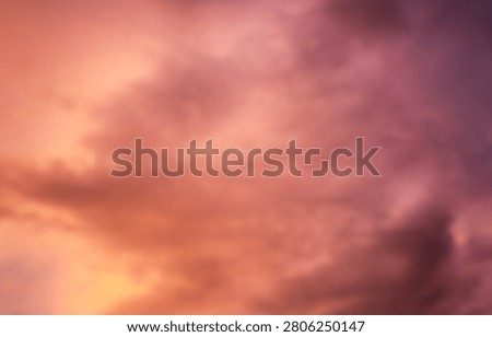 Dramatic sunset over a dark landscape with fiery clouds, atmosph