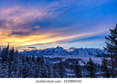 Dramatic Sunset over the Grand Tetons in Jackson Hole during Winter - Shutterstock ID 1919890745