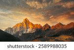 Dramatic sunset over mountain range silhouette