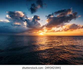 Dramatic Sunset over the Ocean with Dark Clouds