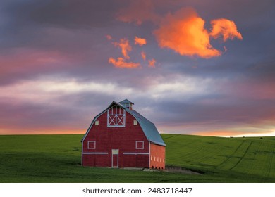 Dramatic sunset over a red barn in the Palouse in eastern Washington state - Powered by Shutterstock