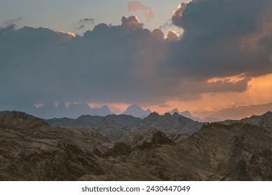 Dramatic Sunset over Red Sea Hills mountain chain and Sahara desert. Sun already behind horizon line, close up photo. Hurghada, Egypt