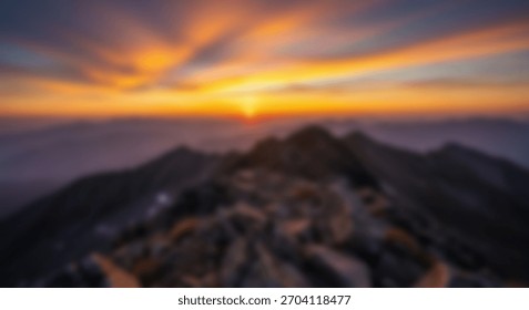 Dramatic Sunset Over Rugged Mountain Peaks with Scenic Landscape, Golden Hour, and Sky View.