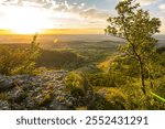 Dramatic sunset over scenic rock ledge in the Swabian Jura in Southern Germany